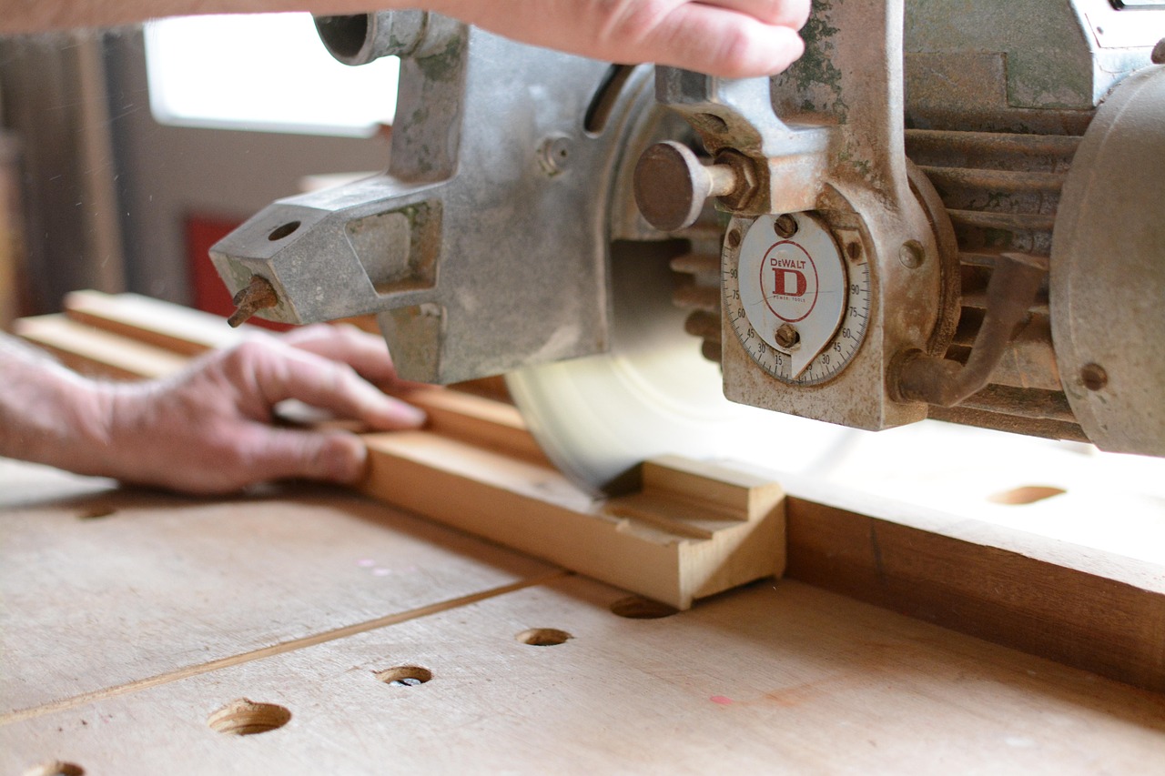 Skilled craftsman using precision DeWalt router for custom woodworking project in Richmond, Virginia workshop