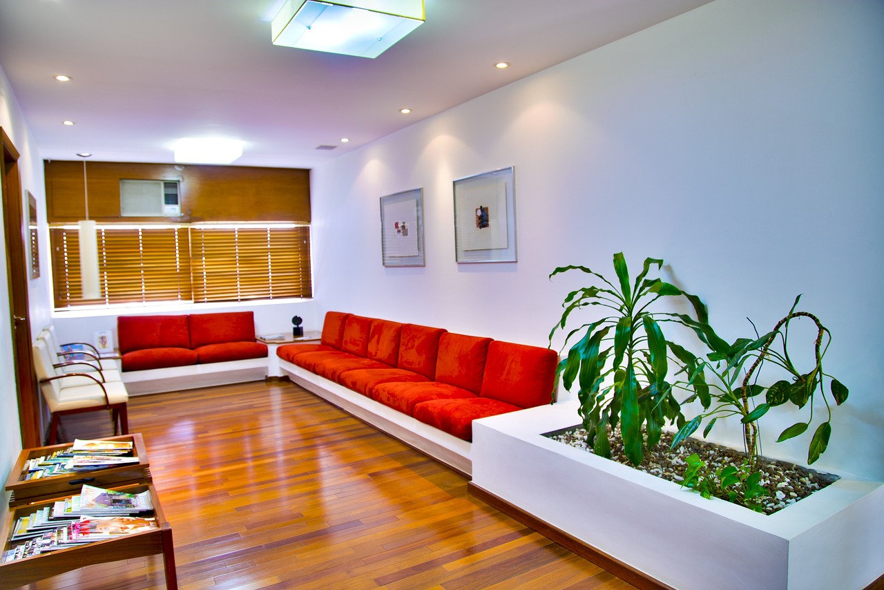 Modern medical office waiting room with built-in seating, integrated planters, sky ceiling panel, and calming design elements in Henrico County, Virginia