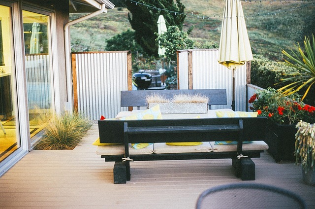 Modern outdoor living space with custom deck, dining area, privacy screening, and landscaping in Virginia