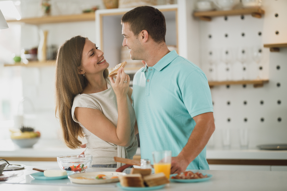 Happy couple enjoying their beautifully remodeled kitchen in Richmond, Virginia home
